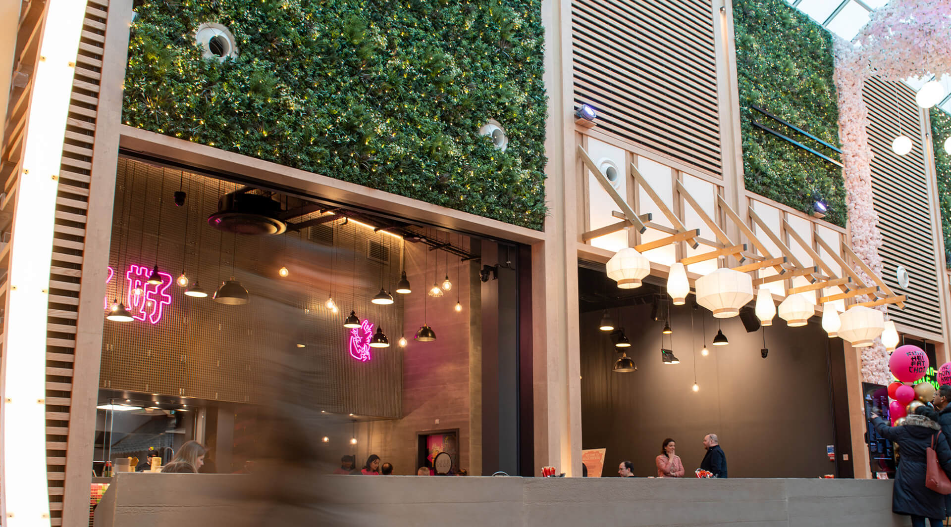 Trafford Centre Hero Image - Sculptform Click-on Battens and Acoustic Slat Wall create warmth between Garden Screen Panels  